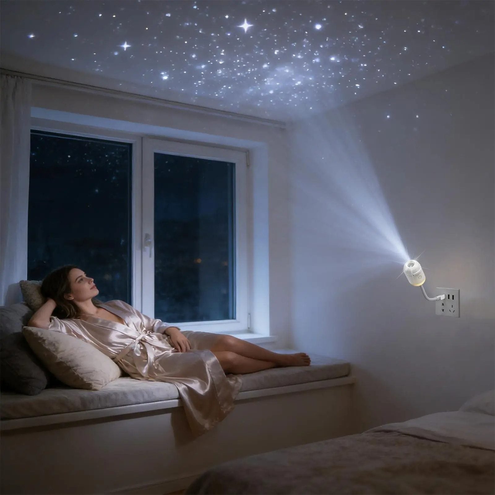 Galaxy Star Projector plugged into a wall outlet, woman relaxing by the window